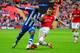 LONDON, ENGLAND - APRIL 12: Marc-Antoine Fortune of Wigan Athletic is tackled by Thomas Vermaelen of Arsenal during the FA Cup Semi-Final match between Wigan Athletic and Arsenal at Wembley Stadium on April 12, 2014 in London, England. (Photo by Mike Hewitt/Getty Images)