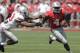 Ohio State running back Curtis Samuel, right, runs around the outside as linebacker Darron Lee defends during their spring NCAA college football game Saturday, April 12, 2014, in Columbus, Ohio. (AP Photo/Jay LaPrete)