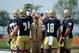 Notre Dame coach Brian Kelly huddles with the offense at Culver Academies at the beginning of fall practice Monday August 4, 2014 in Culver, Ind. Notre Dame opens the season against Rice at home Saturday Aug. 30. (AP Photo/Joe Raymond)