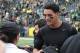 May 3, 2014; Eugene, OR, USA; Oregon Ducks Markus Mariota (8) exchanges his uniform with a US Military person at Autzen Stadium. Mandatory Credit: Scott Olmos-USA TODAY Sports