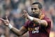 AS Roma's Mehdi Benatia, of Morocco, left, mimics shooting as he celebrates after scoring during a Serie A soccer match against Catania in Rome's Olympic Stadium, Sunday, Dec. 22, 2013. (AP Photo/Gregorio Borgia)