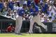 DENVER, CO - AUGUST 07: Chicago Cubs second baseman Javier Baez #9 gets a high five from third base coach Gary Jones #1 after hitting a two-run home run in the eighth inning against the Colorado Rockies at Coors Field on August 7, 2014 in Denver, Colorado. The Chicago Cubs defeated the Colorado Rockies 6-2. (Photo by Trevor Brown, Jr./Getty Images)