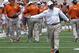 Texas coach Charlie Strong calls out to his players during the first half of the team's Orange and White spring NCAA college football game, Saturday, April 19, 2014, in Austin, Texas. (AP Photo/Michael Thomas)