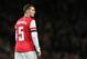 Arsenal's Thomas Vermaelen looks to his right as he watches his teammates during their English League Cup soccer match between Arsenal and Chelsea at the Emirates stadium in London Tuesday, Oct. 29, 2013. (AP Photo/Alastair Grant)