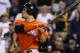 Miami Marlins' Giancarlo Stanton hits a two-run home run off Pittsburgh Pirates relief pitcher Stolmy Pimentel during the ninth inning of a baseball game in Pittsburgh Thursday, Aug. 7, 2014. The Pirates won 7-2. (AP Photo/Gene J. Puskar)