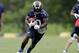 St. Louis Rams running back Zac Stacy runs with the ball during an organized team activity at the NFL football team's practice facility Thursday, June 5, 2014, in St. Louis. (AP Photo/Jeff Roberson)