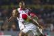 Omar Perez Colombia's Indepentiente, center, celebrates with teammate with Sergio Otalvaro, after Perez scored against Morelia in a Copa Libertadores soccer match in Morelia, Mexico, Tuesday, Jan. 28, 2014. (AP Photo/Christian Palma)