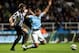 Manchester City's Jack Rodwell, centre, vies for the ball with Newcastle United's Mike Williamson, left, during their English League Cup soccer match at St James' Park, Newcastle, England, Wednesday, Oct. 30, 2013. (AP Photo/Scott Heppell)