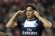 PSG's Edinson Cavani reacts as he celebrates after scoring the opening goal during a Group C Champions League soccer match between Benfica and PSG at the Luz stadium in Lisbon, Tuesday Dec. 10, 2013. (AP Photo/Francisco Seco)