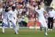 MANCHESTER, ENGLAND - AUGUST 09: England bowler James Anderson (r) goes on a celebration run with Moeen Ali (l) and Chris Jordan (c) after India batsman Virat Kohli is dismissed during day three of the 4th Investec Test match between England and India at Old Trafford on August 9, 2014 in Manchester, England. (Photo by Stu Forster/Getty Images)