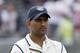 India's captain MS Dhoni stands on the pitch after his team's innings and 54 run loss to England on the third day of the fourth test match of their five match series at Old Trafford cricket ground, in Manchester, England, Saturday, Aug. 9, 2014. (AP Photo/Jon Super)