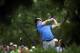 Rory McIlroy, of Northern Ireland, watches his tee shot on the 18th hole during the third round of the PGA Championship golf tournament at Valhalla Golf Club on Saturday, Aug. 9, 2014, in Louisville, Ky. (AP Photo/David J. Phillip)