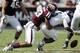 Rice's Driphus Jackson (5) fumbles the ball as he is hit by Texas A&M defender Shaan Washington (33) during the fourth quarter of an NCAA college football game, Saturday, Aug. 31, 2013, in College Station, Texas. Texas A&M won 52-31. (AP Photo/Eric Gay)
