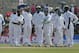 Sri Lankan bowler Rangana Herath, third left, along with teammates await a successful third umpire decision over Pakistani batsman Asad Shafiq during the fifth day of the first test cricket match in Galle, Sri Lanka, Sunday, Aug. 10, 2014. (AP Photo/Eranga Jayawardena)