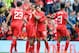 LIVERPOOL, ENGLAND - AUGUST 10: Daniel Sturridge (C) of Liverpool celebrates with team-mate Philippe Coutinho after he scores the first goal of the game for his side during the Pre Season Friendly match between Liverpool and Borussia Dortmund at Anfield on August 10, 2014 in Liverpool, England. (Photo by Clint Hughes/Getty Images)