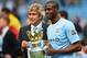 MANCHESTER, ENGLAND - MAY 11: The Manchester City Manager Manuel Pellegrini and Yaya Toure pose with the trophy at the end of the Barclays Premier League match between Manchester City and West Ham United at the Etihad Stadium on May 11, 2014 in Manchester, England. (Photo by Shaun Botterill/Getty Images)