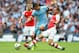 LONDON, ENGLAND - AUGUST 10: Stevan Jovetic of Manchester City is challenged by Jack Wilshere (L) and Aaron Ramsey of Arsenal during the FA Community Shield match between Manchester City and Arsenal at Wembley Stadium on August 10, 2014 in London, England. (Photo by David Rogers/Getty Images)