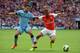 LONDON, ENGLAND - AUGUST 10: Kieran Gibbs of Arsenal competes with Jesus Navas of Manchester City during the FA Community Shield match between Manchester City and Arsenal at Wembley Stadium on August 10, 2014 in London, England. (Photo by Ross Kinnaird/Getty Images)