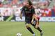 Liverpool FC midfielder Lazar Markovic (50) controls the ball against the Olympiacos during the first half of International Champions Cup soccer match in Chicago, Sunday, July 27, 2014. The Liverpool FC won 1-0. (AP Photo/Nam Y. Huh)