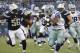 Dallas Cowboys running back Joseph Randle, right, battles San Diego Chargers inside linebacker Donald Butler while running with the ball during the first half of a preseason NFL football game Thursday, Aug. 7, 2014, in San Diego. (AP Photo/Jae C. Hong)
