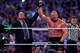 Paul Heyman, left, celebrates with Brock Lesnar after his win over the Undertaker during Wrestlemania XXX at the Mercedes-Benz Super Dome in New Orleans on Sunday, April 6, 2014. (Jonathan Bachman/AP Images for WWE)