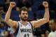 Minnesota Timberwolves forward Kevin Love (42) celebrates in an NBA basketball game against the San Antonio Spurs at the Target Center on in Minneapolis on Tuesday, April 8, 2014. (AP Photo/Hannah Foslien)