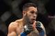 Jan 15, 2014; Duluth, GA, USA; Brad Tavares (blue gloves) fights Lorenz Larkin (not pictured) during UFC Fight Night at Gwinnett Center. Tavares won. Mandatory Credit: Joshua S. Kelly-USA TODAY Sports