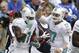 Miami Dolphins' Ryan Tannehill (17) celebrates with Mike Wallace (11) after Wallace scored on an 18-yard touchdown reception during the first half an NFL football game against the Indianapolis Colts Sunday, Sept. 15, 2013, in Indianapolis. (AP Photo/Michael Conroy)