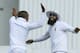 South African players Dane Piedt, left, and Hashim Amla celebrate the wicket of Zimbabwean batsman Brendan Taylor during the cricket Test match against South Africa at the Harare Sports club, in Harare Zimbabwe Tuesday, Aug. 12, 2014. (AP Photo/Tsvangirayi Mukwazhi)