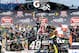 BROOKLYN, MI - JUNE 15: Jimmie Johnson, driver of the #48 Lowe's/Kobalt Tools Chevrolet, celebrates in Victory Lane after winning the NASCAR Sprint Cup Series Quicken Loans 400 at Michigan International Speedway on June 15, 2014 in Brooklyn, Michigan. (Photo by Jason Miller/Getty Images)