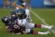 CHICAGO, IL - AUGUST 08: Willie Young #97 of the Chicago Bears tackles Nick Foles of the Philadelphia Eagles after he releases a pass during the first quarter of a preseason game at Soldier Field on August 8, 2014 in Chicago, Illinois. (Photo by Jonathan Daniel/Getty Images)
