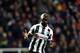 Newcastle United's captain Cheick Tiote, celebrates after their victory over Anzhi Makhachkala at the end of their Europa League round of 16 second leg soccer match at St James' Park, Newcastle, England, Thursday, March 14, 2013. (AP Photo/Scott Heppell)