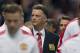 Manchester United's new manager Louis van Gaal, centre, takes to the touchline before his team's pre season friendly soccer match against Valencia at Old Trafford Stadium, Manchester, England, Tuesday Aug. 12, 2014. (AP Photo/Jon Super)