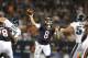 Chicago Bears quarterback Jimmy Clausen (8) throws a touchdown pass to wide receiver Micheal Spurlock (18) Chicago Bears quarterback Jimmy Clausen (8) throws a pass in the second half of an NFL preseason football game against the Philadelphia Eagles Friday, Aug. 8, 2014, in Chicago. (AP Photo/Nam Y. Huh)