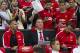 Manchester United's new manager Louis van Gaal, centre, takes his seat along side assistant manager Ryan Giggs, left, prior to his team's pre-season friendly soccer match, against Valencia at Old Trafford Stadium, Manchester, England, Tuesday Aug. 12, 2014. (AP Photo/Jon Super)