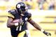 Sep 8, 2013; Pittsburgh, PA, USA; Pittsburgh Steelers wide receiver Markus Wheaton (11) returns a kick-off against the Tennessee Titans during the fourth quarter at Heinz Field. The Tennessee Titans won 16-9. Mandatory Credit: Charles LeClaire-USA TODAY Sports