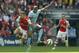 Arsenal's Jack Wilshere, left competes for the ball with Manchester City's Fernando Fracisco Reges during the English FA Community Shield soccer match at Wembley Stadium, London Sunday, Aug. 10, 2014. (AP Photo/Alastair Grant)