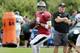 Philadelphia Eagles quarterback Nick Foles fades back to throw as head coach Chip Kelly, right, stands near during an NFL Football training camp scrimmage of the New England Patriots and Eagles in Foxborough, Mass., Tuesday, Aug. 12, 2014. (AP Photo/Charles Krupa)