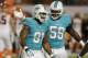 Miami Dolphins middle linebacker Dannell Ellerbe (59) congratulates Miami Dolphins defensive end Cameron Wake (91) after Wake recovered a fumble by Cincinnati Bengals quarterback Andy Dalton (14) during the first half of an NFL football game, Thursday, Oct. 31, 2013, in Miami Gardens, Fla. (AP Photo/Wilfredo Lee)
