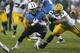 NASHVILLE, TN - AUGUST 09: Bishop Sankey #20 of the Tennessee Titans runs with the ball in the second half of an NFL preseason game against the Green Bay Packers at LP Field on August 9, 2014 in Nashville, Tennessee. The Titans won 20-16. (Photo by Joe Robbins/Getty Images)