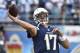 San Diego Chargers quarterback Philip Rivers gets loose throwing for a preseason NFL football game against the Dallas Cowboys Thursday, Aug. 7, 2014, in San Diego. (AP Photo/Denis Poroy)