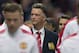 Manchester United's new manager Louis van Gaal, centre, takes to the touchline before his team's pre season friendly soccer match against Valencia at Old Trafford Stadium, Manchester, England, Tuesday Aug. 12, 2014. (AP Photo/Jon Super)