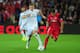 CARDIFF, WALES - AUGUST 12: Real Madrid player Toni Kroos (l) outpaces Daniel Carrico of Seville during the UEFA Super Cup match between Real Madrid and Sevilla FC at Cardiff City Stadium on August 12, 2014 in Cardiff, Wales. (Photo by Stu Forster/Getty Images)
