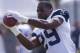 Dallas Cowboys running back DeMarco Murray (29) catches a pass at NFL football training camp, Wednesday, July 30, 2014, in Oxnard, Calif. (AP Photo/Ringo H.W. Chiu)