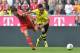 Bayern's Javier Martinez of Spain, left, and Dortmund's Pierre-Emerick Aubameyang of Gabon challenge for the ball during the Bundesliga soccer match between FC Bayern Munich and Borussia Dortmund in Munich, Germany, on Saturday, April 12, 2014. (AP Photo/Kerstin Joensson)