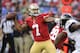 San Francisco 49ers quarterback Colin Kaepernick (7) throws to a receiver as he is pressured in the first half of an NFL preseason football game against the Baltimore Ravens, Thursday, Aug. 7, 2014, in Baltimore. (AP Photo/Nick Wass)
