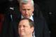 SOUTHAMPTON, ENGLAND - MARCH 29: Alan Pardew the Newcastle United manager walks up behind Newcastle United owner Mike Ashley prior to kickoff during the Barclays Premier League match between Southampton and Newcastle United at the St Mary's Stadium on March 29, 2014 in Southampton, England. (Photo by Richard Heathcote/Getty Images)