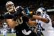 NEW ORLEANS, LA - DECEMBER 08: Jimmy Graham #80 of the New Orleans Saints has a pass broken up by Mike Mitchell #21 of the Carolina Panthers at Mercedes-Benz Superdome on December 8, 2013 in New Orleans, Louisiana. (Photo by Chris Graythen/Getty Images)