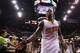 PHOENIX, AZ - APRIL 14: Eric Bledsoe #2 of the Phoenix Suns high fives fans as he walks off the court following the NBA game against the Memphis Grizzlies at US Airways Center on April 14, 2014 in Phoenix, Arizona. The Grizzlies defeated the Suns 97-91. NOTE TO USER: User expressly acknowledges and agrees that, by downloading and or using this photograph, User is consenting to the terms and conditions of the Getty Images License Agreement. (Photo by Christian Petersen/Getty Images)