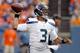 Seattle Seahawks quarterback Russell Wilson (3) throws against the Denver Broncos during the first half of an NFL preseason football game, Thursday, Aug. 7, 2014, in Denver. (AP Photo/Jack Dempsey)